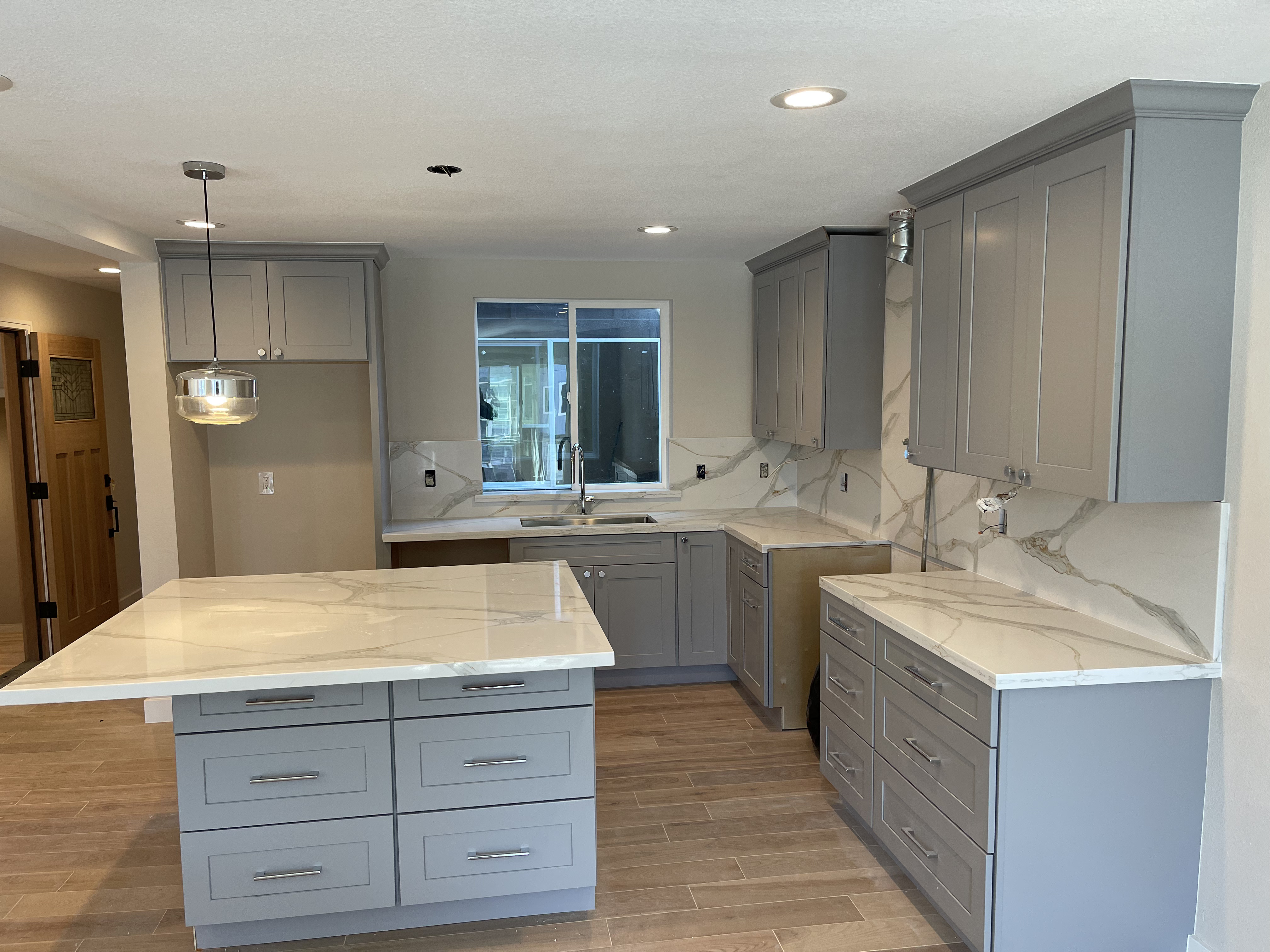 CFCC kitchen remodel · grey shaker cabinets, calacatta quartz